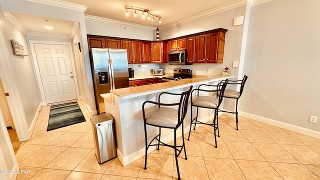 17643 Front Beach Rd Unit 1704, Panama City Beach, FL 32413 - kitchen with stainless steel appliances, light tile patterned floors, a peninsula, a breakfast bar, and crown molding