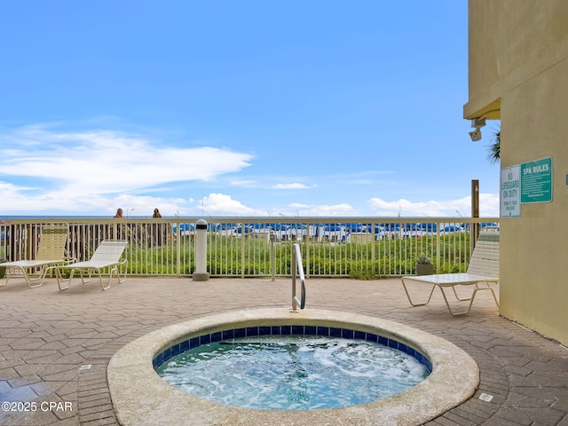 17757 Front Beach Rd Unit 2201A, Panama City Beach, FL 32413 - view of pool featuring a hot tub, a patio, and fence