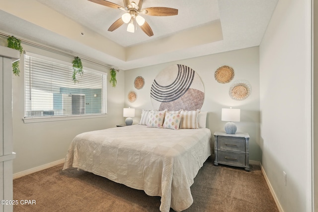 1515 SE Miracle Strip Pkwy Unit 609, Fort Walton Beach, FL 32548 - bedroom with carpet flooring, baseboards, a raised ceiling, and ceiling fan