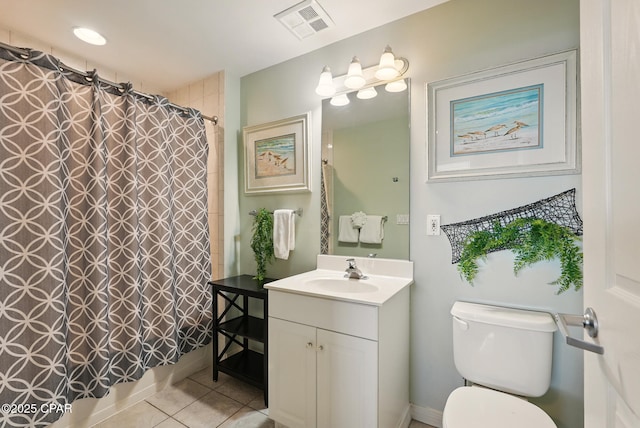 1515 SE Miracle Strip Pkwy Unit 609, Fort Walton Beach, FL 32548 - full bathroom with tile patterned floors, vanity, toilet, and a shower with shower curtain