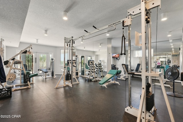 1515 SE Miracle Strip Pkwy Unit 609, Fort Walton Beach, FL 32548 - exercise room featuring a textured ceiling