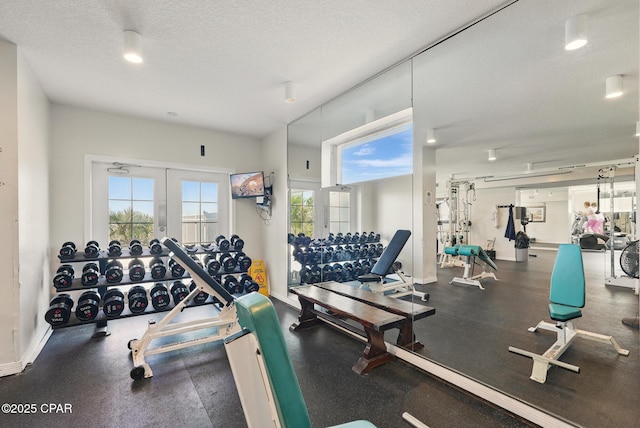 1515 SE Miracle Strip Pkwy Unit 609, Fort Walton Beach, FL 32548 - exercise room with a textured ceiling and baseboards