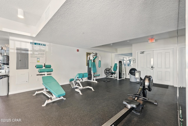 1515 SE Miracle Strip Pkwy Unit 609, Fort Walton Beach, FL 32548 - gym with a textured ceiling, electric panel, and baseboards