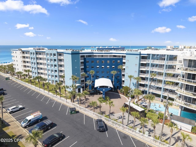 1515 SE Miracle Strip Pkwy Unit 609, Fort Walton Beach, FL 32548 - view of apartment building / complex featuring uncovered parking and a water view