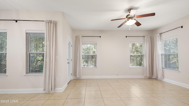 76 Mosaic Oaks Cir, Santa Rosa Beach, FL 32459 - spare room featuring ceiling fan, light tile patterned floors, and baseboards