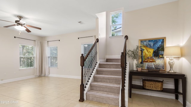 76 Mosaic Oaks Cir, Santa Rosa Beach, FL 32459 - stairs with ceiling fan, tile patterned floors, and baseboards