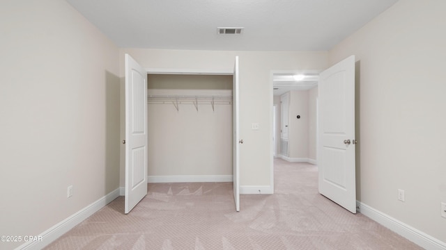 76 Mosaic Oaks Cir, Santa Rosa Beach, FL 32459 - unfurnished bedroom featuring light carpet, a closet, and baseboards