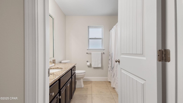 76 Mosaic Oaks Cir, Santa Rosa Beach, FL 32459 - bathroom with vanity, toilet, tile patterned floors, baseboards, and a shower with curtain
