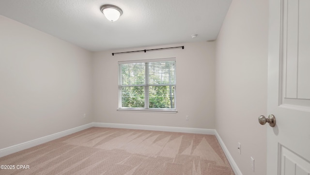 76 Mosaic Oaks Cir, Santa Rosa Beach, FL 32459 - spare room featuring baseboards, light carpet, and a smoke detector