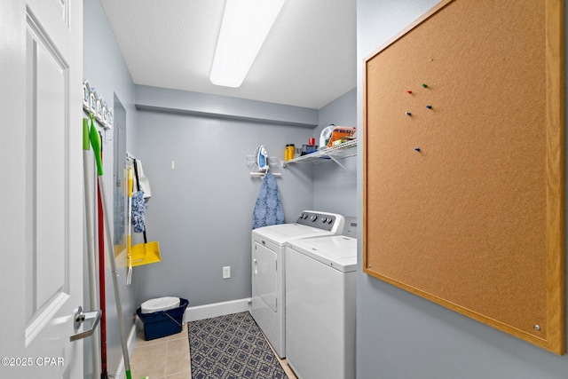 14825 Front Beach Rd Unit 2210, Panama City Beach, FL 32413 - laundry room featuring washer and clothes dryer, tile patterned floors, and baseboards