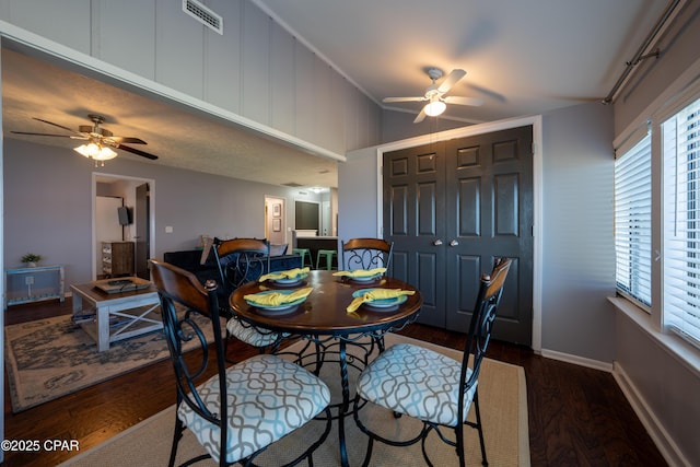 dining area with ceiling fan, wood finished floors, and baseboards