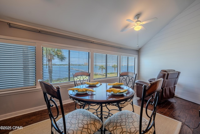 dining area featuring vaulted ceiling, wood finished floors, plenty of natural light, and ceiling fan