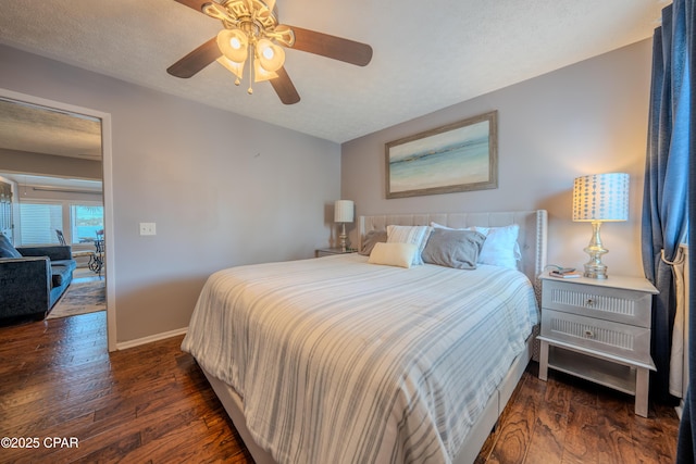 bedroom with wood finished floors, baseboards, and ceiling fan