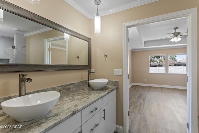 468 Forest Shore Dr, Miramar Beach, FL 32550 - full bath with crown molding, wood finished floors, double vanity, ceiling fan, and baseboards