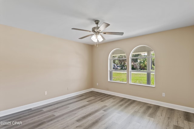 468 Forest Shore Dr, Miramar Beach, FL 32550 - empty room with wood finished floors, ceiling fan, and baseboards