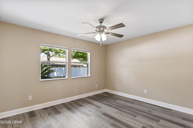 468 Forest Shore Dr, Miramar Beach, FL 32550 - unfurnished room with wood finished floors, ceiling fan, and baseboards
