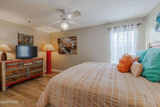 17462 Front Beach Rd Unit 55201, Panama City Beach, FL 32413 - bedroom featuring wood finished floors and a ceiling fan