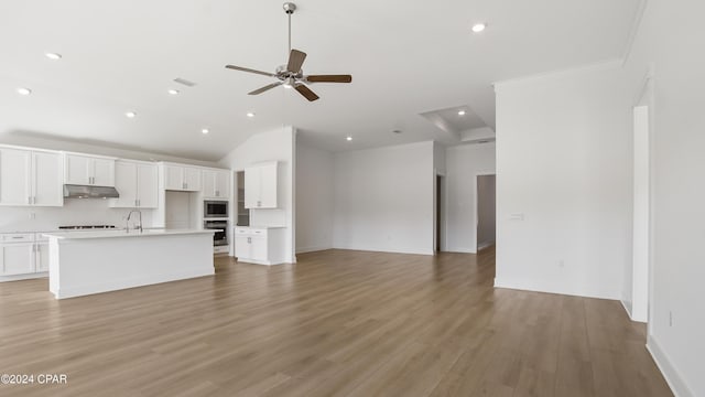 unfurnished living room featuring a ceiling fan, baseboards, recessed lighting, light wood-style floors, and vaulted ceiling