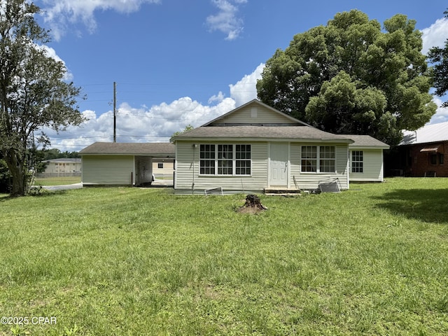 1331 Jackson Ave, Chipley, FL 32428 - rear view of house featuring a yard and roof with shingles