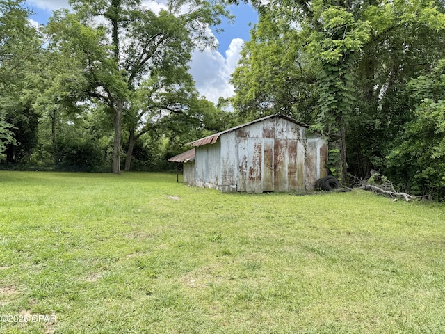 1331 Jackson Ave, Chipley, FL 32428 - view of green lawn featuring an outdoor structure