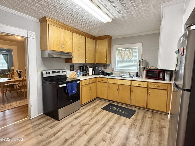 1331 Jackson Ave, Chipley, FL 32428 - kitchen with appliances with stainless steel finishes, an ornate ceiling, ornamental molding, under cabinet range hood, and light countertops
