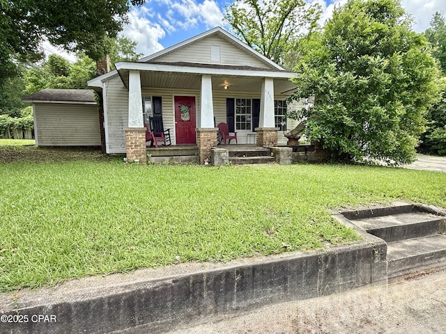 1331 Jackson Ave, Chipley, FL 32428 - view of front of home with a front yard and covered porch
