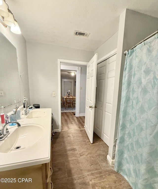 1331 Jackson Ave, Chipley, FL 32428 - bathroom featuring double vanity and curtained shower