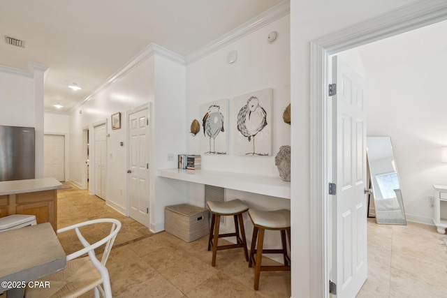231 Somerset Bridge Rd Unit 1103, Santa Rosa Beach, FL 32459 - kitchen featuring ornamental molding, a breakfast bar, light tile patterned floors, light countertops, and baseboards