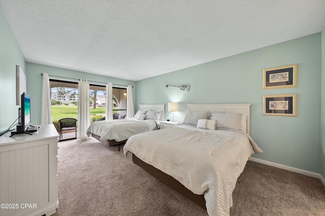 520 Richard Jackson Blvd Unit 703, Panama City Beach, FL 32407 - bedroom with carpet floors, a textured ceiling, and access to exterior
