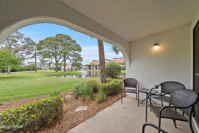520 Richard Jackson Blvd Unit 703, Panama City Beach, FL 32407 - view of patio / terrace featuring a water view