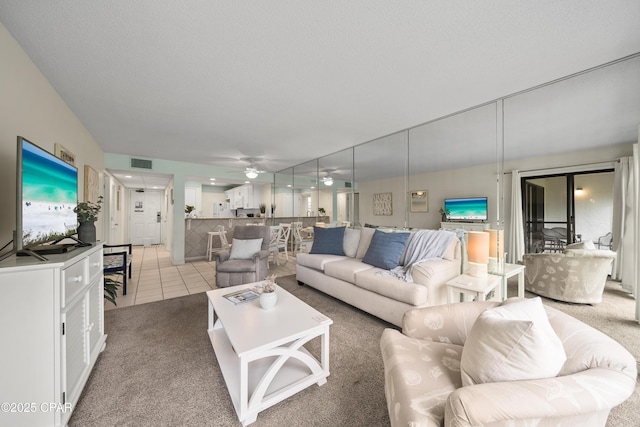 520 Richard Jackson Blvd Unit 703, Panama City Beach, FL 32407 - living area featuring ceiling fan and light carpet