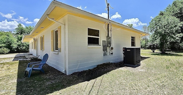 9541 Stauber Ln, Youngstown, FL 32466 - view of home's exterior with central AC unit and a yard