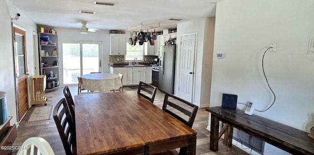 9541 Stauber Ln, Youngstown, FL 32466 - dining room featuring a ceiling fan and wood finished floors