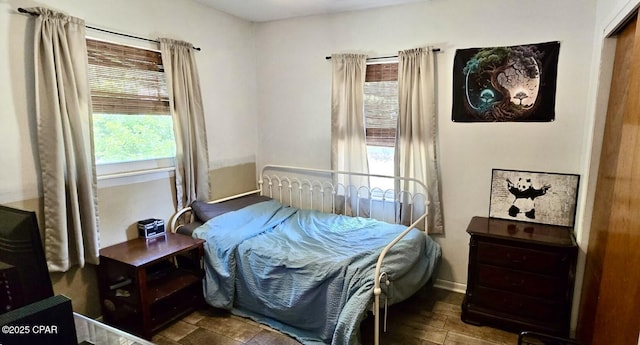 9541 Stauber Ln, Youngstown, FL 32466 - bedroom with multiple windows and baseboards