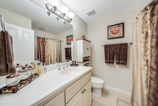 bathroom with toilet, vanity, baseboards, and curtained shower