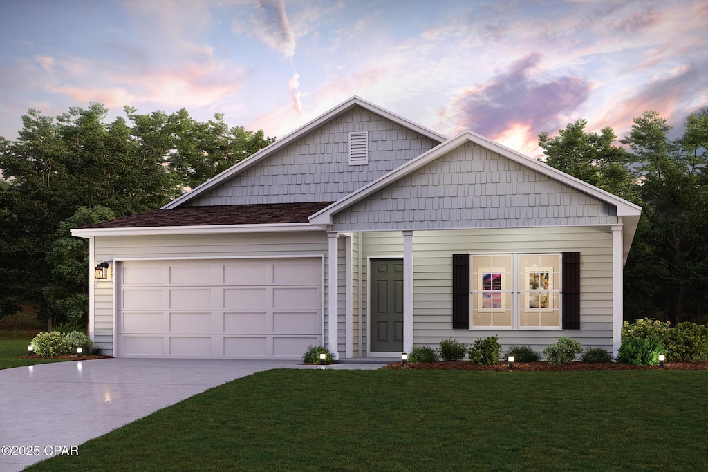 1617 Fountain Ct, Chipley, FL 32428 - view of front of home featuring driveway, a yard, and an attached garage