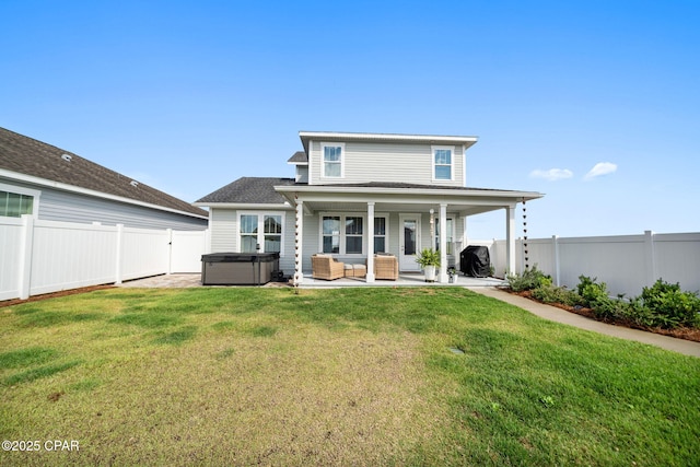 1009 N Discovery Loop, Panama City, FL 32405 - back of house with a hot tub, a patio, and outdoor lounge area