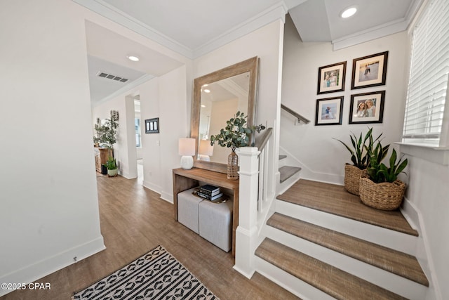 1009 N Discovery Loop, Panama City, FL 32405 - hallway with stairway, wood finished floors, baseboards, ornamental molding, and recessed lighting