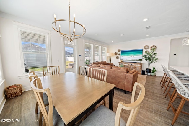 1009 N Discovery Loop, Panama City, FL 32405 - dining area with a chandelier, wood finished floors, ornamental molding, and recessed lighting