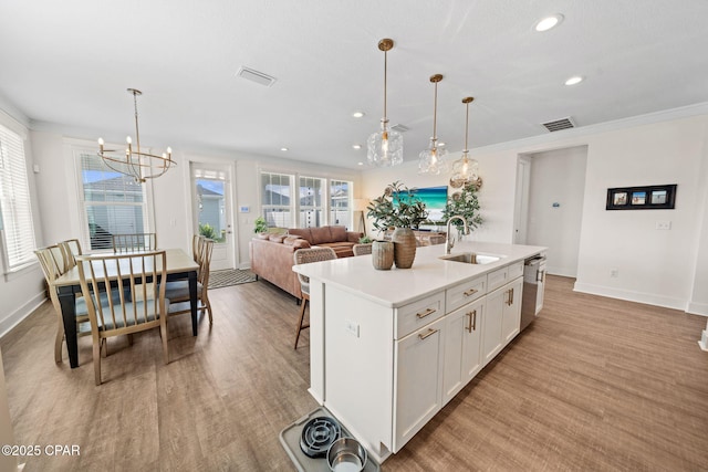 1009 N Discovery Loop, Panama City, FL 32405 - kitchen with a sink, dishwasher, recessed lighting, white cabinets, and light countertops