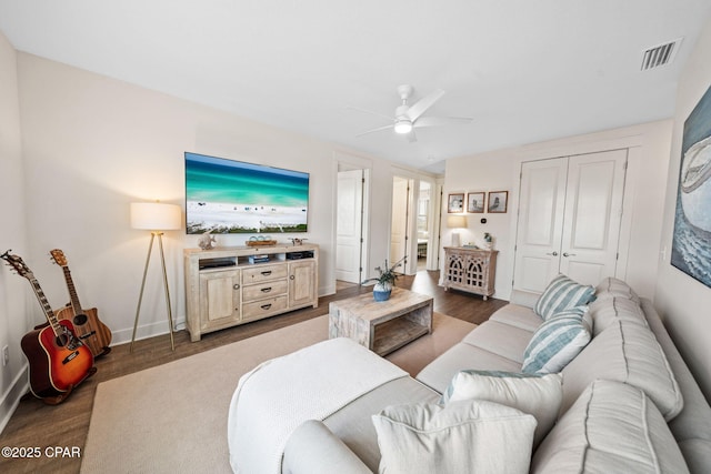 1009 N Discovery Loop, Panama City, FL 32405 - living room featuring wood finished floors, a ceiling fan, and baseboards