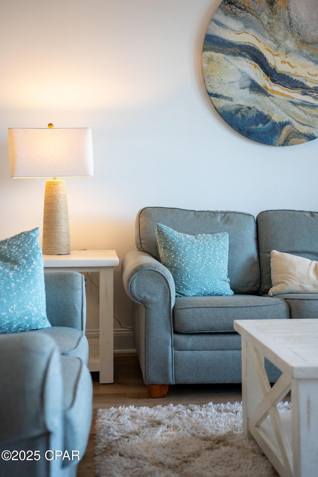 sitting room featuring wood finished floors and baseboards
