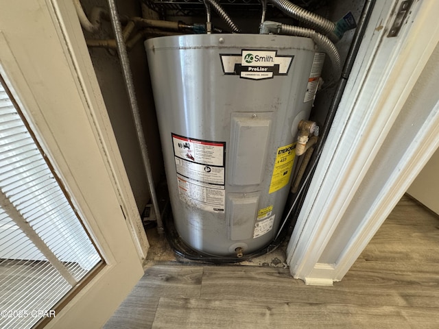 9900 S Thomas Dr Unit 2023, Panama City Beach, FL 32408 - utility room with electric water heater