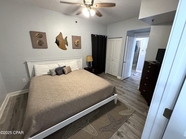 9900 S Thomas Dr Unit 2023, Panama City Beach, FL 32408 - bedroom with wood finished floors, baseboards, and a closet