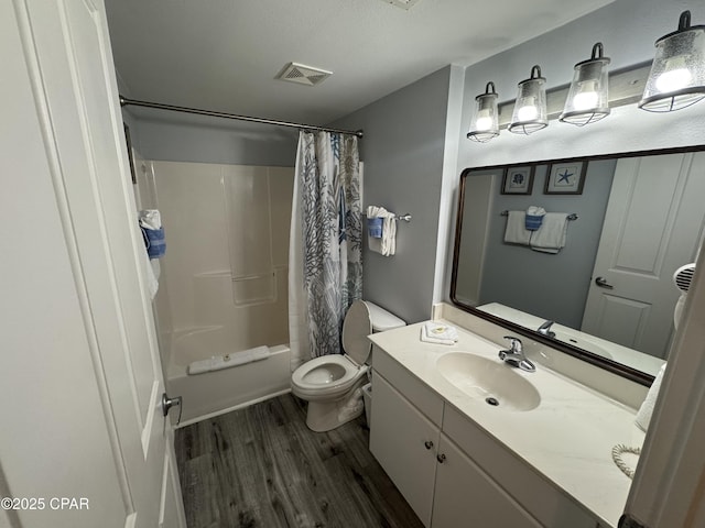 9900 S Thomas Dr Unit 2023, Panama City Beach, FL 32408 - full bath featuring wood finished floors, toilet, vanity, and shower / tub combo