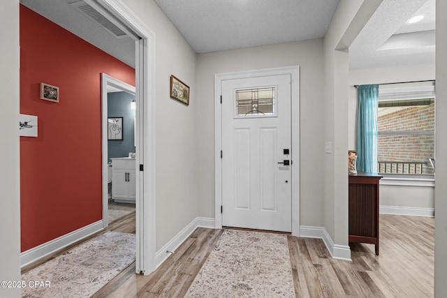 4724 Bylsma Cir, Panama City, FL 32404 - foyer featuring light wood-style floors and baseboards