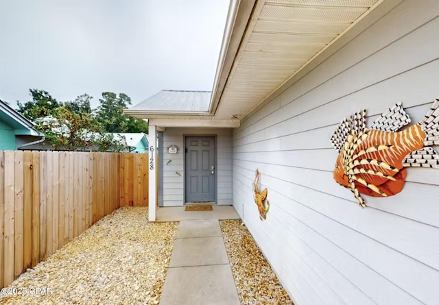 6128 Loquat St, Panama City Beach, FL 32408 - view of exterior entry with metal roof