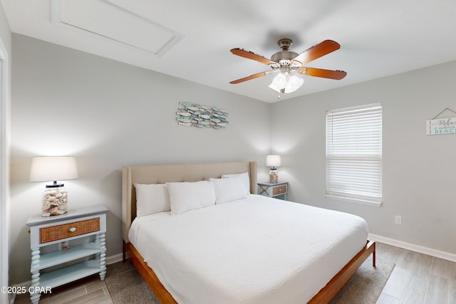 6128 Loquat St, Panama City Beach, FL 32408 - bedroom with attic access, light wood finished floors, baseboards, and a ceiling fan
