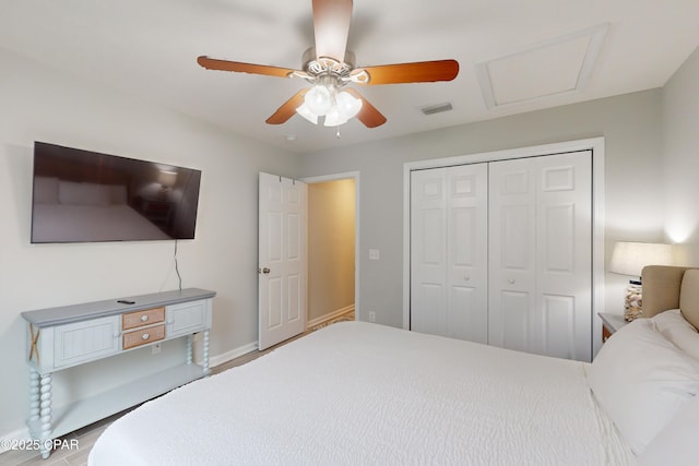 6128 Loquat St, Panama City Beach, FL 32408 - bedroom featuring a closet, attic access, ceiling fan, and baseboards