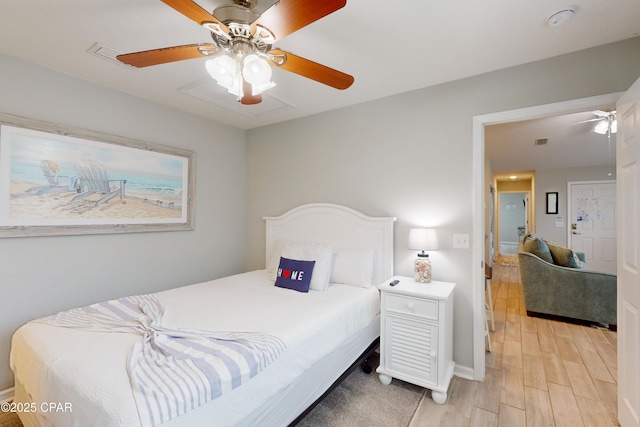 6128 Loquat St, Panama City Beach, FL 32408 - bedroom featuring light wood-type flooring, baseboards, and ceiling fan